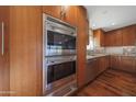 Modern kitchen featuring stainless steel appliances including built in double oven and spacious countertops at 2718 E Campo Bello Dr, Phoenix, AZ 85032