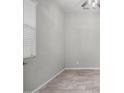 Clean bedroom with neutral paint, tile flooring, white trim, and natural light at 2905 E Aloe Pl, Chandler, AZ 85286