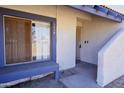 Inviting front entrance with shaded seating and security door for added peace of mind at 5458 W El Caminito Dr, Glendale, AZ 85302