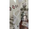 Elegant entryway with a staircase, dark wood floors, and a view into other rooms at 20821 W Ridge Rd, Buckeye, AZ 85396