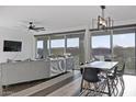 Open-concept living and dining area with bright, natural light and modern furnishings at 23282 S 229Th Pl, Queen Creek, AZ 85142