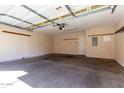 Spacious two-car garage with an automatic door and ample room for storage at 2450 W Glenrosa Ave # 41, Phoenix, AZ 85015