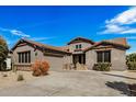 Beautiful home featuring a spacious driveway and well-maintained landscaping at 30789 N Raindance Rd, San Tan Valley, AZ 85143