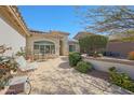 Covered outdoor patio area with table and chairs, perfect for relaxing and entertaining at 3777 N 162Nd Ave, Goodyear, AZ 85395