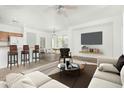 Bright living room showcasing an open floor plan, modern decor, and lots of natural light at 7739 E Butte St, Mesa, AZ 85207