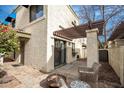 Outdoor patio area with wicker furniture, decorative fire pit, and mature landscaping at 8841 S 48Th St # 1, Phoenix, AZ 85044