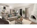 Inviting living room with fireplace, modern furniture, and open layout to kitchen and dining area at 8841 S 48Th St # 1, Phoenix, AZ 85044