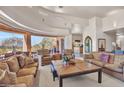 Expansive living room with a large window offering views of the outdoor golf course and patio at 10040 E Happy Valley Rd # 449, Scottsdale, AZ 85255