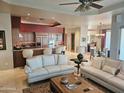 Bright, open living space connecting the kitchen, living room, and dining area for easy entertaining at 10236 W Westwind Dr, Peoria, AZ 85383