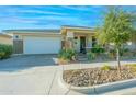 Charming home with a two-car garage and well-maintained landscaping, creating a welcoming curb appeal at 10545 E Texas Ave, Mesa, AZ 85212