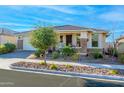 Charming single-story home features desert landscaping and welcoming covered front porch at 10545 E Texas Ave, Mesa, AZ 85212