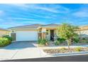 Charming single-story home features a two car garage, desert landscaping and welcoming front porch at 10545 E Texas Ave, Mesa, AZ 85212