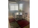 Cozy dining area with natural light, table with seating for four, and neutral tones at 12510 W Wells St, El Mirage, AZ 85335