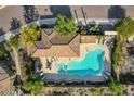 Aerial view of home featuring a large private pool, desert landscaping, and plenty of patio space at 13044 N Northstar Dr, Fountain Hills, AZ 85268