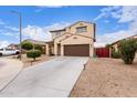 Charming two-story home featuring a desert landscape, brown garage door and a classic design at 16789 W Moreland St, Goodyear, AZ 85338