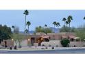 Charming desert home with mature landscaping, stucco exterior and tile roof, and mountain views at 18753 E Chinle Dr, Rio Verde, AZ 85263