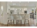 Beautiful kitchen features a marble countertop bar, stainless steel appliances, and bright lighting at 25409 N Ranch Gate Rd, Scottsdale, AZ 85255