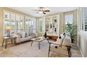 Bright living room with a built-in bookcase and comfortable seating area at 29816 N 129Th Gln, Peoria, AZ 85383