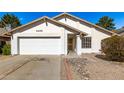 Charming single story home with a two car garage, desert landscaping and a cheerful front entry at 4436 W Morrow Dr, Glendale, AZ 85308