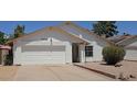 Charming single-story home with a well-maintained front yard and a two-car garage at 4436 W Morrow Dr, Glendale, AZ 85308