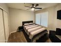 Neutral bedroom with a ceiling fan, a comfortable bed, and a bedside table at 4925 E Desert Cove Ave # 117, Scottsdale, AZ 85254