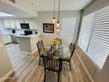 Cozy dining area featuring a glass table and chairs with a window offering natural light at 4925 E Desert Cove Ave # 117, Scottsdale, AZ 85254