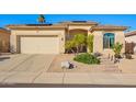 Charming single-story home featuring a desert landscape, solar panels, and a neutral-toned facade at 6442 W Cavedale Dr, Phoenix, AZ 85083