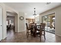 Cozy dining area with access to the kitchen and sliding doors to the backyard at 77 W Diamond Trl, San Tan Valley, AZ 85143