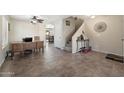 Spacious living room featuring tile floors, staircase, and neutral paint at 77 W Diamond Trl, San Tan Valley, AZ 85143