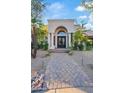 Beautiful entrance featuring a stone walkway, meticulously maintained plants, and a grand archway at 8336 E Calle De Alegria --, Scottsdale, AZ 85255