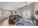 Cozy living room with plush leather seating and stylish decor at 9001 W Lone Cactus Dr, Peoria, AZ 85382