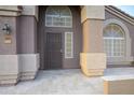 The front entrance features a secure wrought iron door and classic architectural details at 9144 W Quail Ave, Peoria, AZ 85382