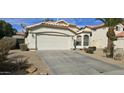 Charming single Gathering home features a two-car garage, desert landscaping, and a tile roof at 9614 W Mary Ann Dr, Peoria, AZ 85382