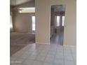 Open-concept living area with tile flooring, a dining nook, and connecting rooms at 10622 W Mohawk Ln, Peoria, AZ 85382