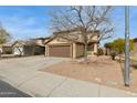 Charming two-story home featuring a two car garage, xeriscaping, and desert landscaping at 12054 W Aster W Dr, El Mirage, AZ 85335