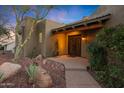 Inviting entryway featuring double doors, a cozy porch, and desert landscaping at 15601 E El Lago Blvd, Fountain Hills, AZ 85268
