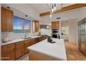 Well-lit kitchen featuring granite countertops, stainless appliances, and scenic views at 15601 E El Lago Blvd, Fountain Hills, AZ 85268