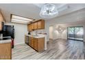 Inviting living room with wood flooring and sliding glass doors to the outdoor at 2146 W Isabella Ave # 215, Mesa, AZ 85202