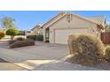 A well maintained house with a two car garage and desert landscaping at 30663 N 44Th St, Cave Creek, AZ 85331