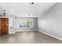 Spacious and bright living room featuring new laminate flooring and large windows at 30663 N 44Th St, Cave Creek, AZ 85331