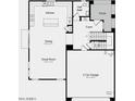 Open-concept floor plan featuring the kitchen, dining area, great room, and a two-car garage at 3809 N 99Th Dr, Avondale, AZ 85392