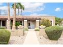 Inviting front entrance with decorative planters and desert landscaping at 5420 E Acoma Dr, Scottsdale, AZ 85254