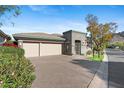 Lovely home featuring desert landscaping, gated entry, and a two-car garage with wide driveway at 6426 N 27Th St, Phoenix, AZ 85016