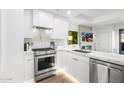 Bright kitchen featuring white cabinets, stainless steel appliances, and elegant countertops for a modern look at 7161 E Rancho Vista Dr # 1011, Scottsdale, AZ 85251