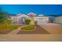 Beautiful single-Gathering home features stone accents, desert landscaping, and a spacious two-car garage at 9388 W Cashman Dr, Peoria, AZ 85383