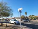 Street view displaying the home's neighborhood featuring cars parked along the sides of the roads at 13839 N 33Rd St, Phoenix, AZ 85032