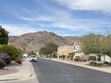 Scenic street view showcases the community near mountains and clear blue skies at 16823 S 27Th Ave, Phoenix, AZ 85045