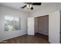 Well-lit bedroom showcasing a spacious closet and a bright window at 18474 N Celis St, Maricopa, AZ 85138
