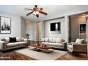 Inviting living room features neutral colors and comfortable seating at 18474 N Celis St, Maricopa, AZ 85138