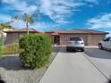 Lovely single-story home featuring a three-car garage and well-maintained landscaping for enhanced curb appeal at 32071 N Chestnut Trl, San Tan Valley, AZ 85143